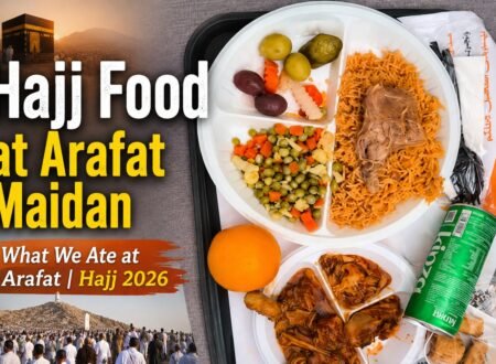 Pilgrims enjoying a meal at Arafat during Hajj 2026, featuring goat biryani and chicken dishes.
