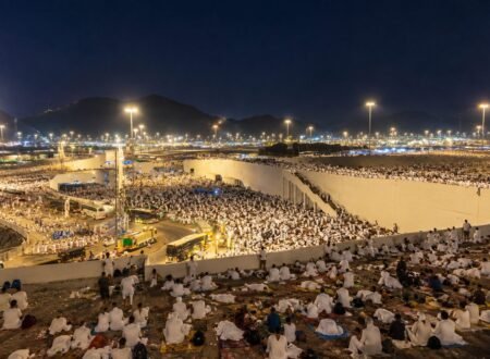 Pilgrims resting under the night sky in Muzdalifah during Hajj 2026