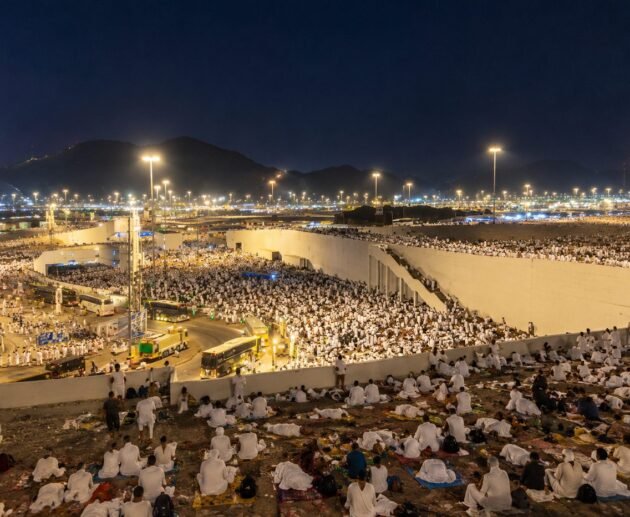 Pilgrims resting under the night sky in Muzdalifah during Hajj 2026