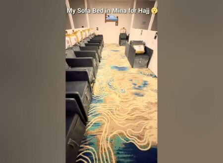 Inside a Mina tent during Hajj 2026 with rows of sofa beds for pilgrims