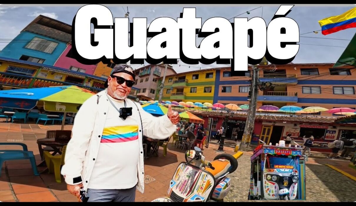 Colorful street in Guatapé Colombia with vibrant zócalos and umbrellas
