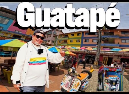 Colorful street in Guatapé Colombia with vibrant zócalos and umbrellas