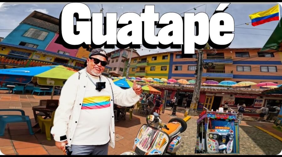 Colorful street in Guatapé Colombia with vibrant zócalos and umbrellas
