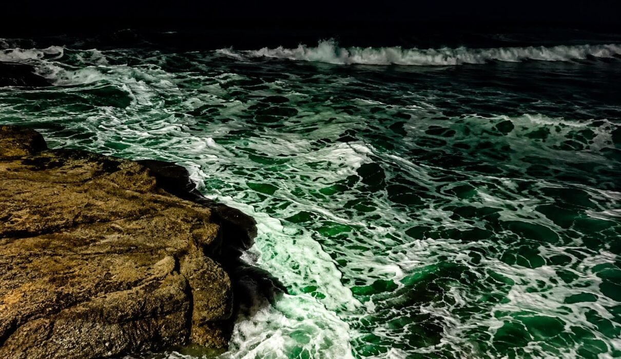 Night waves crashing along the shore at El Tunco Beach in El Salvador